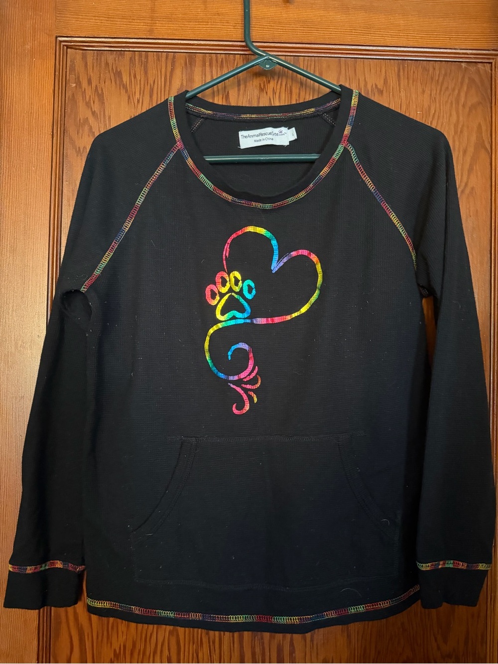 Black Women's Pullover Sweatshirt with Rainbow Paw Heart Accent